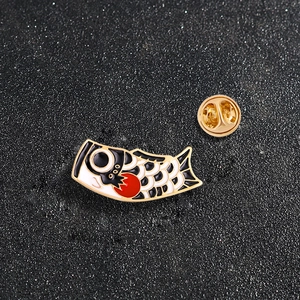 Creative enamel carp koi fish badge lapel pin with gold butterfly clutch on black background