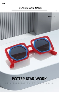 Detail of avant-garde square sunglasses featuring a red and blue double-frame design