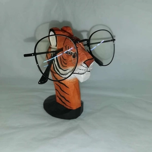 Handcrafted wooden tiger eyeglass holder stand with animal carving for desk storage