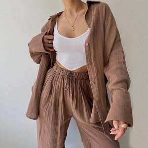 Two-piece casual brown set featuring a long sleeve shirt and wide-leg drawstring pants