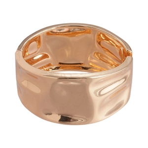 Minimalist wide geometric cuff bracelet with rose gold wavy textured surface on white backdrop