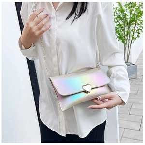 Detail of laser iridescent chain bag with heart-shaped metal lock and rectangular flap