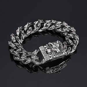Vintage silver tiger head chain bracelet with oxidized finish on black reflective surface