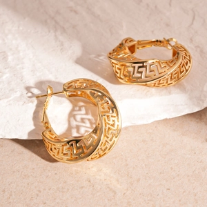 Vintage gold hollow hoop earrings with Greek fret pattern on textured stone