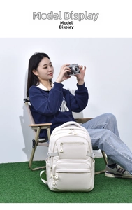 Detailed side view of beige minimalist backpack with adjustable straps and side pockets