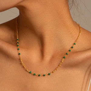 18K gold plated stainless steel necklace featuring green turquoise beads on model