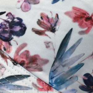 Detailed macro view of the floral print fabric with durable double-stitched seams
