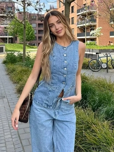 Women summer blue denim vest and wide-leg pants set shown in an outdoor fashion shoot