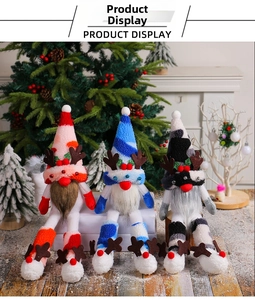 Three long-legged Christmas gnomes with reindeer antlers for festive tabletop decoration