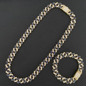 Detail of hip hop Cuban link set featuring blue enamel and sparkling crystal stones