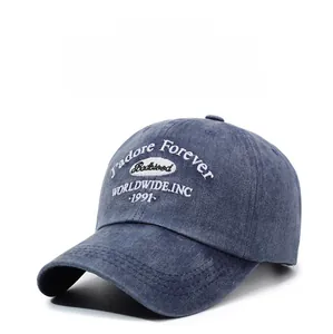 Detail of navy blue washed denim baseball cap featuring white 3D embroidery branding