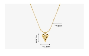 Detail of 18K gold plated heart pendant with precise measurements on beaded chain