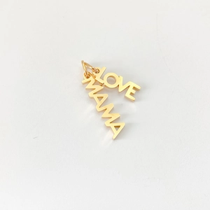 Detailed view of gold plated stainless steel LOVE and MAMA pendants for DIY jewelry