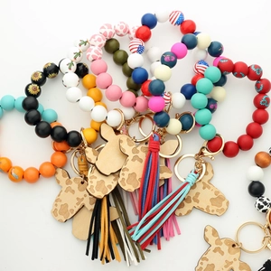 Western style cow head silicone bead bracelets with tassels and gold keyrings