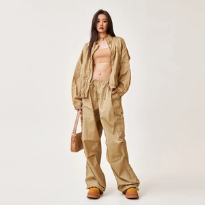 Khaki nylon tracksuit featuring wide-leg cargo pants and zip-up sports jacket