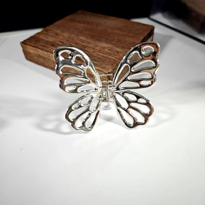 Elegant hollow butterfly hair claw clip in silver alloy metal with minimalist style