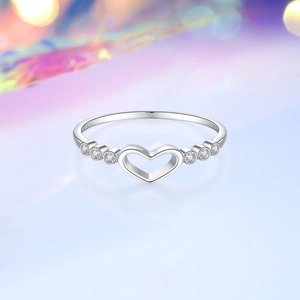 Silver S925 sterling silver heart ring with sparkling cubic zirconia on dreamy purple background
