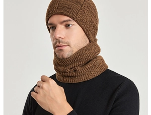 Close-up of thick brown knit texture on men's winter hat and scarf set for warmth