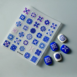 Detailed 5D embossed nail stickers featuring blue and white porcelain floral patterns