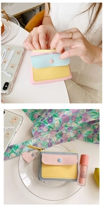 Close-up of tricolor macaron pastel wallet showing the texture and button closure