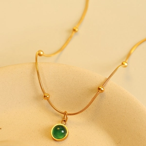 Vintage titanium steel snake chain necklace with round green gemstone pendant for women
