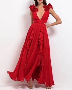 Detailed view of 3D floral accents on a red V-neck dress with stylish waist cut-out