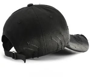 Detail view of the metal buckle and distressed fabric on a stone-washed baseball cap