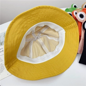 Detail view of cotton sun hat interior showing stitching and white sweatband lining