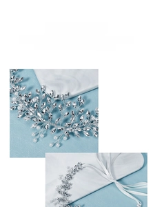 Detailed macro view of handcrafted bridal headband with copper wire, pearls and rhinestones