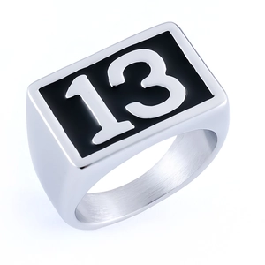 Detailed macro shot of the square black enamel face featuring the lucky number 13 on a ring