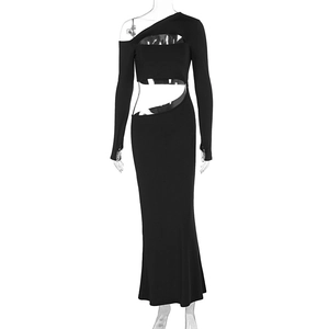 Close-up of black one-shoulder dress featuring cut-out waist and fishtail hem detail