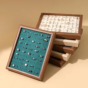 Stackable wooden jewelry tray with velvet slots for ring and earring display