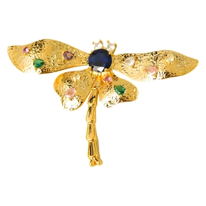 Detail of dragonfly brooch with colorful cubic zirconia and a large oval blue gemstone