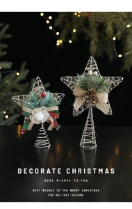 Detail of glittered iron wire Christmas tree star toppers with pine cones and ribbons