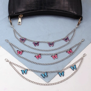 Silberne Handtaschenketten mit bunten Tropföl-Schmetterlingsanhängern in Pink und Blau