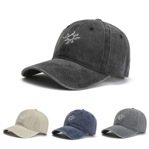 Detail view of cotton baseball caps with sun embroidery in four vintage colors