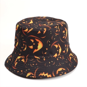 Close-up of Halloween bucket hat featuring glowing pumpkin prints and twill fabric texture