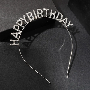 Elegant silver rhinestone Happy Birthday headband on textured black surface