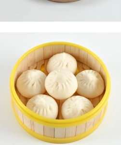 Close-up of six realistic PVC steamed buns inside a traditional bamboo steamer tray