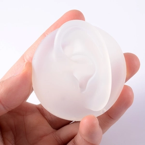 Handheld translucent white silicone ear model for piercing practice and display