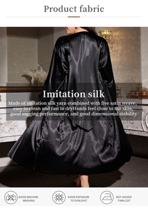 Detail of black silk satin robe fabric texture with washing instructions and smooth finish