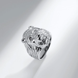 Detailed macro view of a silver lion head ring with sharp metallic mane texture