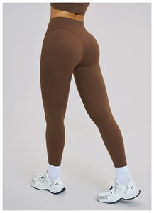 Detail view of high-waisted dark brown yoga pants showing V-shape butt-lifting seam line