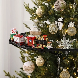 Electric Christmas tree track train set with red and green carriages for holiday decor