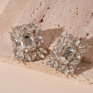 Detail of silver vintage Baroque earrings with large rectangular crystal and rhinestones