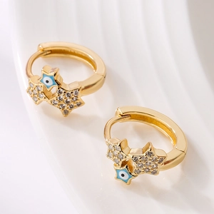 Gold plated hoop earrings with evil eye and star charms featuring blue enamel details
