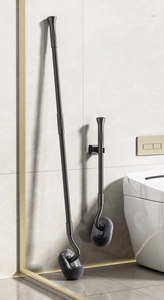 Detail of extendable gunmetal gray toilet brush with L-shaped head for corner cleaning