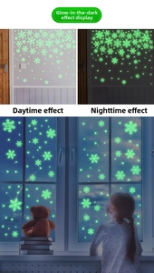 Glow-in-the-dark snowflake wall stickers with star decals in day and night contrast