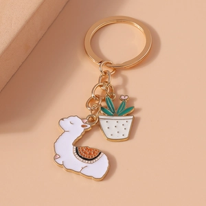 Cute alpaca and potted plant enamel keychain with gold metal finish and colorful charms