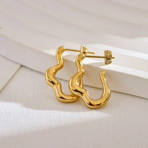 Chic geometric irregular wavy gold stud earrings with a minimalist liquid metal design